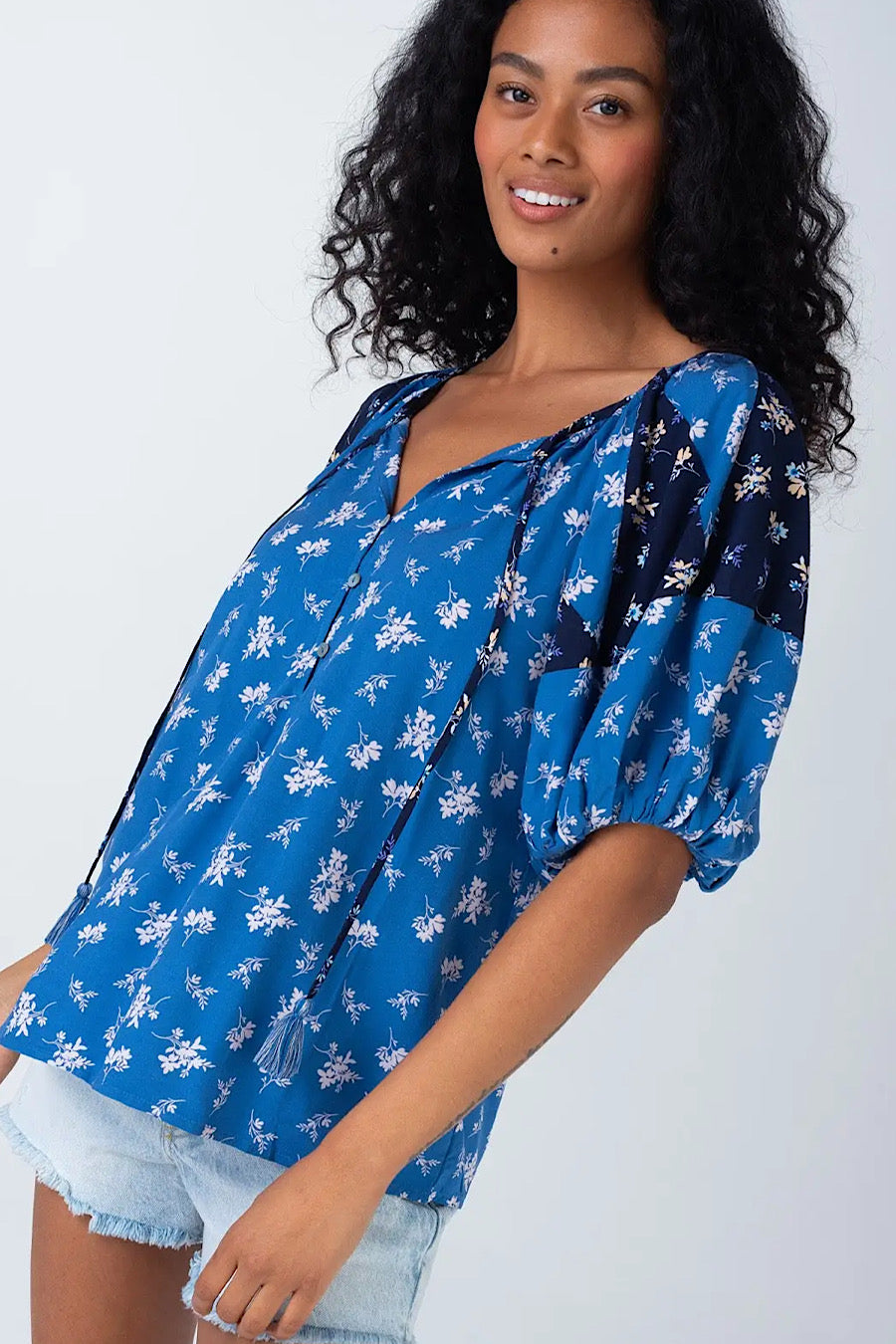 Coastal Floral Tassel Tie Neck Blouse